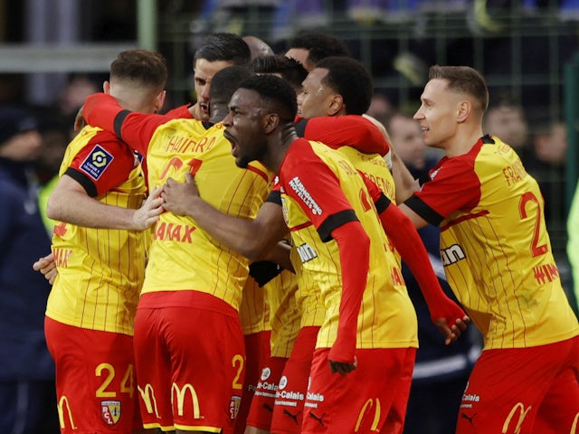 Lens players celebrate their first goal on March 4, 2023