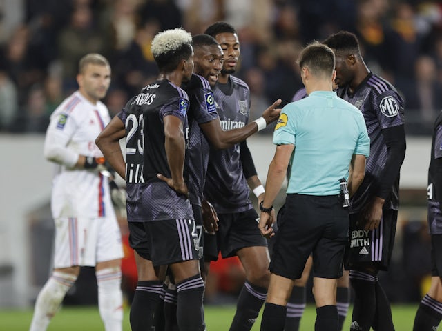 Lyon players remonstrate with referee on October 2, 2022