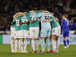 Newport County players huddle before the match on November 8, 2022