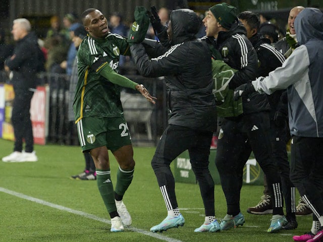 Portland Timbers defender Juan David Mosquera (29) celebrates with teammates after scoring a goal in the first half against Sporting Kansas City at Providence Park on February 27, 2023