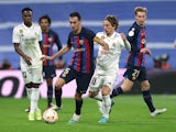Real Madrid's Luka Modric in action with Barcelona's Sergio Busquets on March 2, 2023