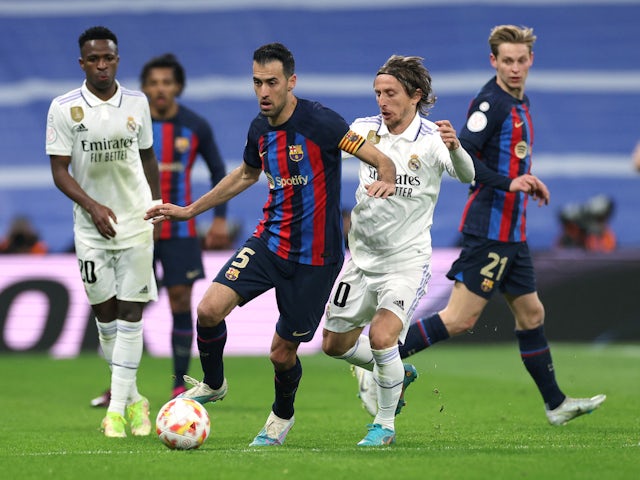 Real Madrid's Luka Modric in action with Barcelona's Sergio Busquets on March 2, 2023