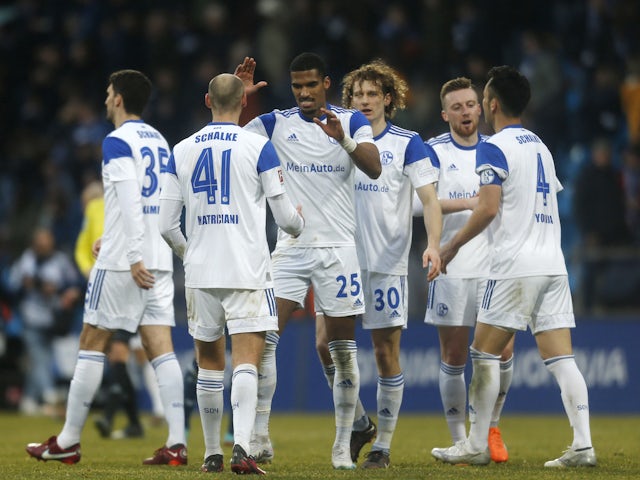 Schalke 04's Henning Matriciani and Moritz Jenz celebrates after the match on March 4, 2023