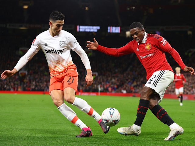 West Ham United's Nayef Aguerd in action with Manchester United's Tyrell Malacia on March 1, 2023