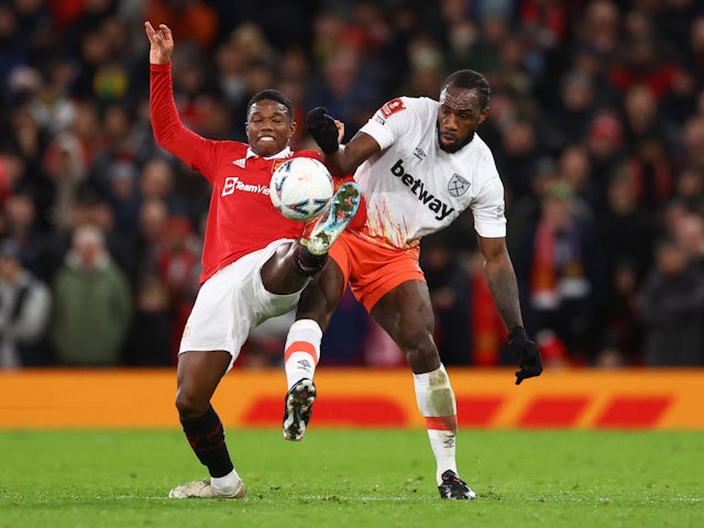 Manchester United's Tyrell Malacia in action with West Ham United's Michail Antonio on March 1, 2023