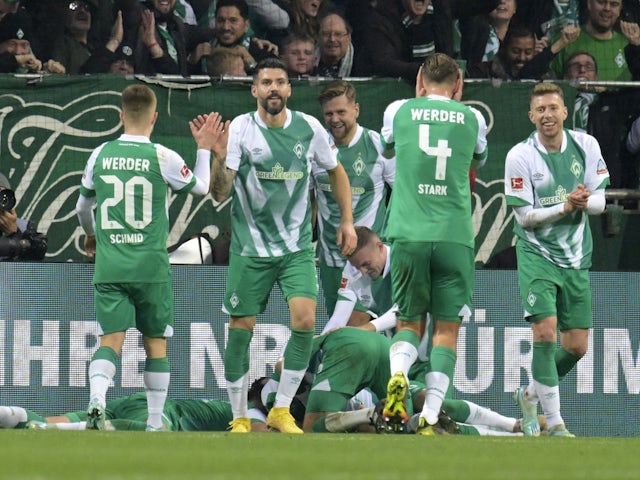 Werder Bremen's Christian Gross celebrates scoring their first goal with teammates on November 12, 2022