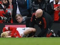 Manchester United attacker Alejandro Garnacho receives treatment on March 12, 2023