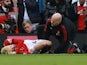 Manchester United attacker Alejandro Garnacho receives treatment on March 12, 2023