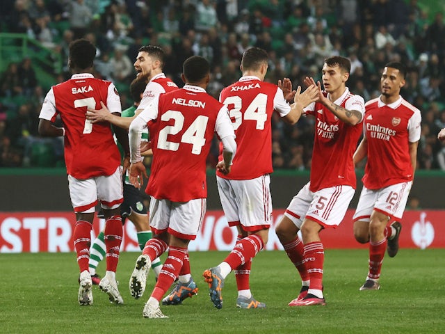 Arsenal players celebrate an own goal scored by Sporting Lisbon's Hidemasa Morita on March 9, 2023