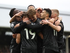 Scintillating Arsenal make history in comfortable Fulham win