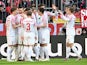 Augsburg's Mergim Berisha celebrates scoring their first goal with teammates on March 11, 2023