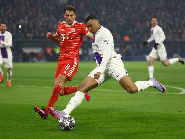 Bayern Munich's Leon Goretzka in action with Paris Saint-Germain's Kylian Mbappe on March 8, 2023