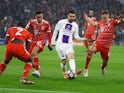 Paris Saint-Germain's Lionel Messi in action with Bayern Munich's Jamal Musiala and Joshua Kimmich on March 8, 2023