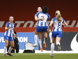 Brighton & Hove Albion Women's Elisabeth Terland celebrates scoring their first goal with Lee Geum-min on March 12, 2023