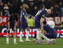 Fenerbahce's Samet Akaydin with teammates look dejected after the match on March 9, 2023