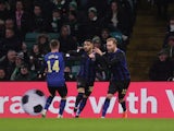 Hearts Josh Ginnelly celebrates scoring their first goal with teammates on March 8, 2023