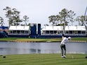 Justin Thomas plays his shot from the 17th tee during the third round of The Players Championship golf tournament at TPC Sawgrass on March 13, 2022
