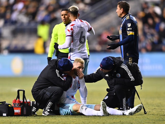 Chicago Fire FC forward Kacper Przybylko (11) receives treatment after an injury against the Philadelphia Union at Subaru Park on March 11, 2023