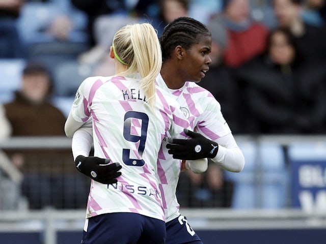 Manchester City Women's Khadija Shaw celebrates scoring their first goal with Chloe Kelly on March 5, 2023