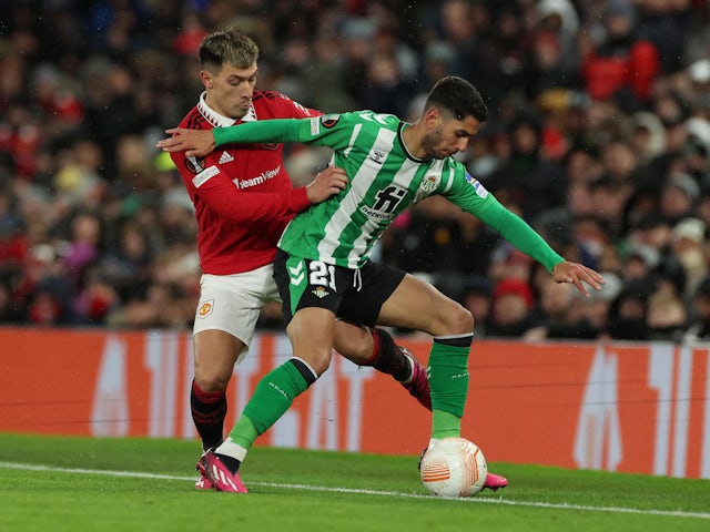 Real Betis' Ayoze Perez in action with Manchester United's Lisandro Martinez on March 9, 2023