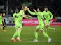 Wolfsburg's Patrik Wimmer celebrates scoring their first goal with Kevin Paredes on March 12, 2023