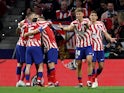 Atletico Madrid's Antoine Griezmann celebrates scoring their first goal with teammates on March 18, 2023