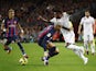 Barcelona's Ronald Araujo in action with Real Madrid's Vinicius Junior on March 19, 2023