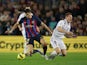 Barcelona's Robert Lewandowski in action with Real Madrid's Toni Kroos on March 19, 2023