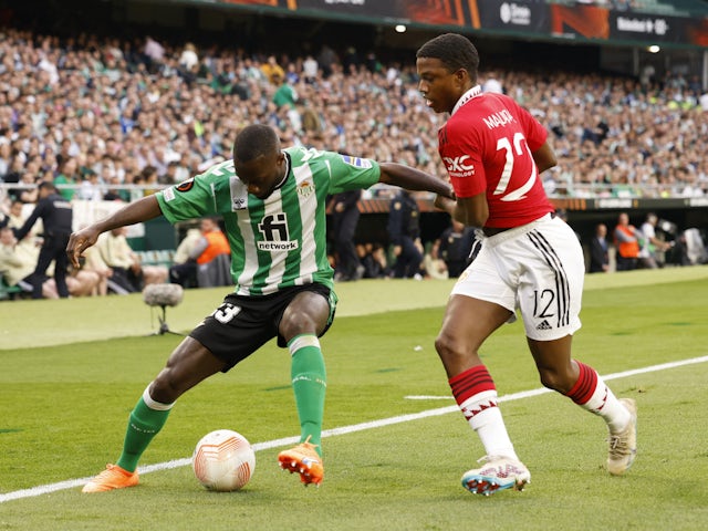 Real Betis' Youssouf Sabaly in action with Manchester United's Tyrell Malacia on March 16, 2023