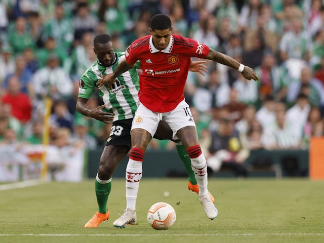 Real Betis' Youssouf Sabaly in action with Manchester United's Marcus Rashford on March 16, 2023