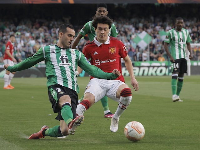 Real Betis attacker Juanmi in action with Manchester United's Facundo Pellistri on March 16, 2023