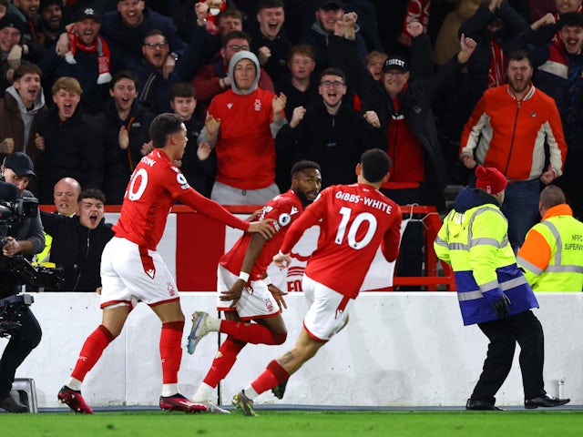  Nottingham Forest's Emmanuel Dennis celebrates scoring their first goal with teammates on March 17, 2023