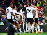 Fulham's Aleksandar Mitrovic celebrates scoring their first goal with teammates on March 19, 2023