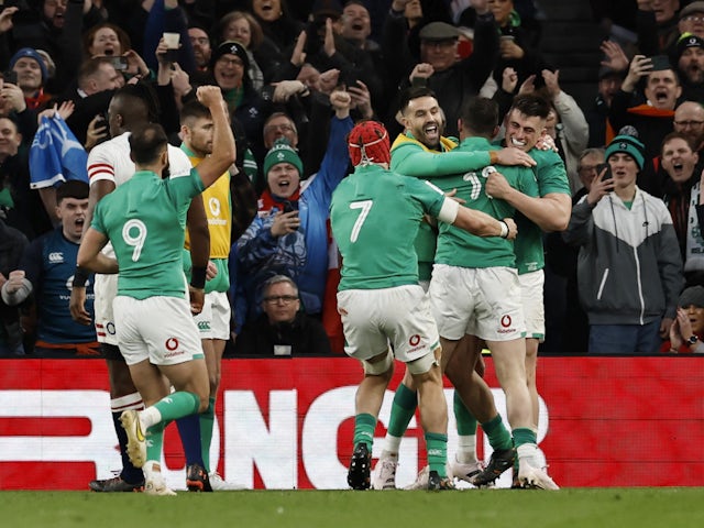 Ireland's Robbie Henshaw celebrates scoring their second try with teammates on March 18, 2023