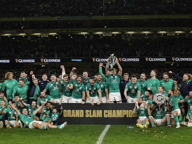 Ireland players celebrate winning the Six Nations Championship and the Grand Slam with the trophies on March 18, 2023