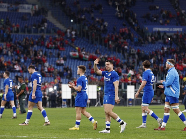 Italy players look dejected after the match on March 11, 2023