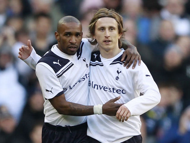Tottenham Hotspur's Jermain Defoe (L) celebrates his second goal against Charlton Athletic with Luka Modric (R) during their FA Cup soccer match at White Hart Lane in London January 9, 2011