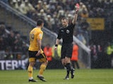 Wolverhampton Wanderers' Jonny is shown a red card by referee Michael Salisbury after a VAR review on March 18, 2023