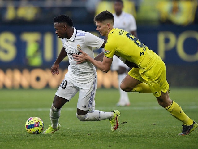 Real Madrid's Vinicius Junior in action with Villarreal's Juan Foyth on January 7, 2023 