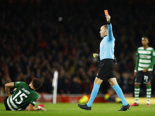 Sporting Lisbon's Manuel Ugarte is shown a red card by referee Antonio Mateu Lahoz after receiving two yellow cards on March 16, 2023