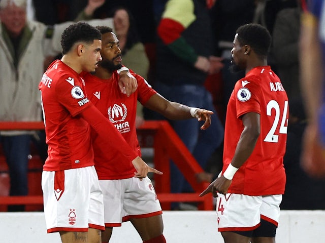 Nottingham Forest's Emmanuel Dennis celebrates scoring their first goal with teammates on March 17, 2023