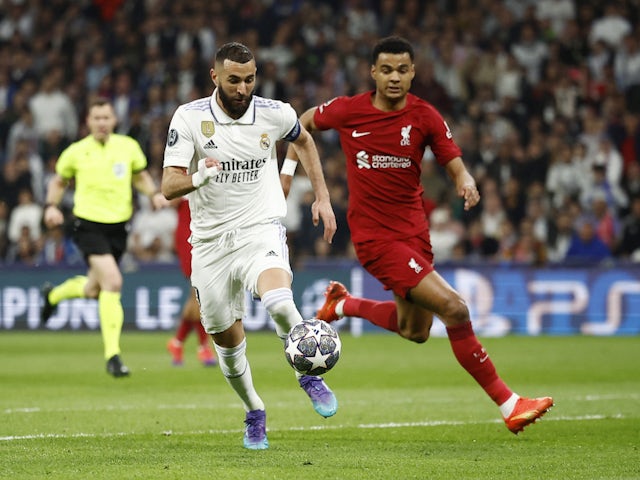 Real Madrid's Karim Benzema in action with Liverpool's Cody Gakpo on March 15, 2023