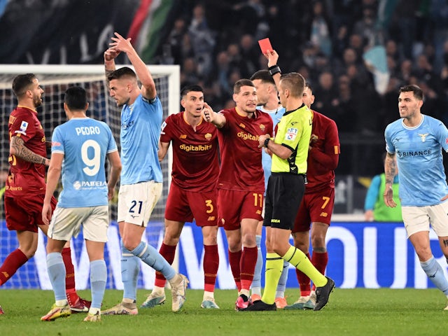 Roma's Roger Ibanez is shown a red card by referee Davide Massa on March 19, 2023