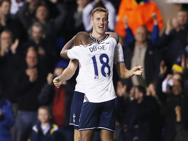 Harry Kane celebrates with Jermain Defoe (L) after scoring the second goal for Tottenham in October 2013