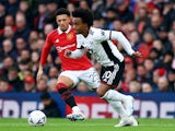Fulham's Willian in action with Manchester United's Jadon Sancho on March 19, 2023