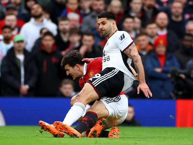 Fulham's Aleksandar Mitrovic is fouled by Manchester United's Harry Maguire on March 19, 2023