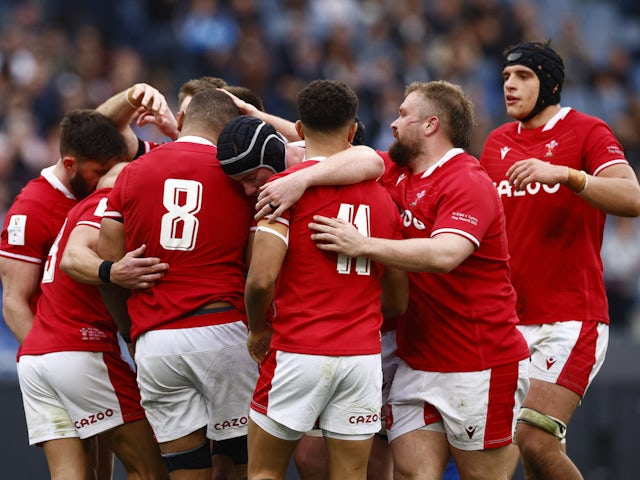 Wales' Taulupe Faletau celebrates scoring their third try with teammates on March 11, 2023