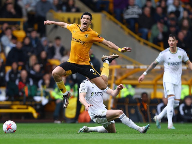 Leeds United's Marc Roca in action with Wolverhampton Wanderers' Raul Jimenez on March 18, 2023