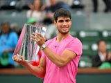 Carlos Alcaraz poses with the trophy after winning the Indian Wells Masters on March 19, 2023