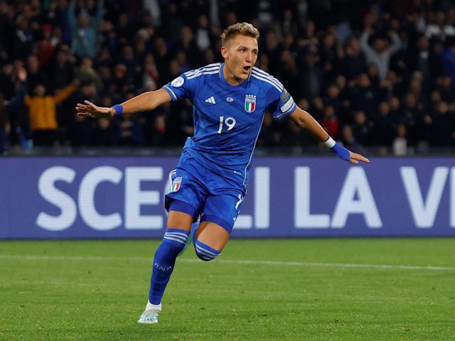 Italy's Mateo Retegui celebrates scoring their first goal on March 23, 2023